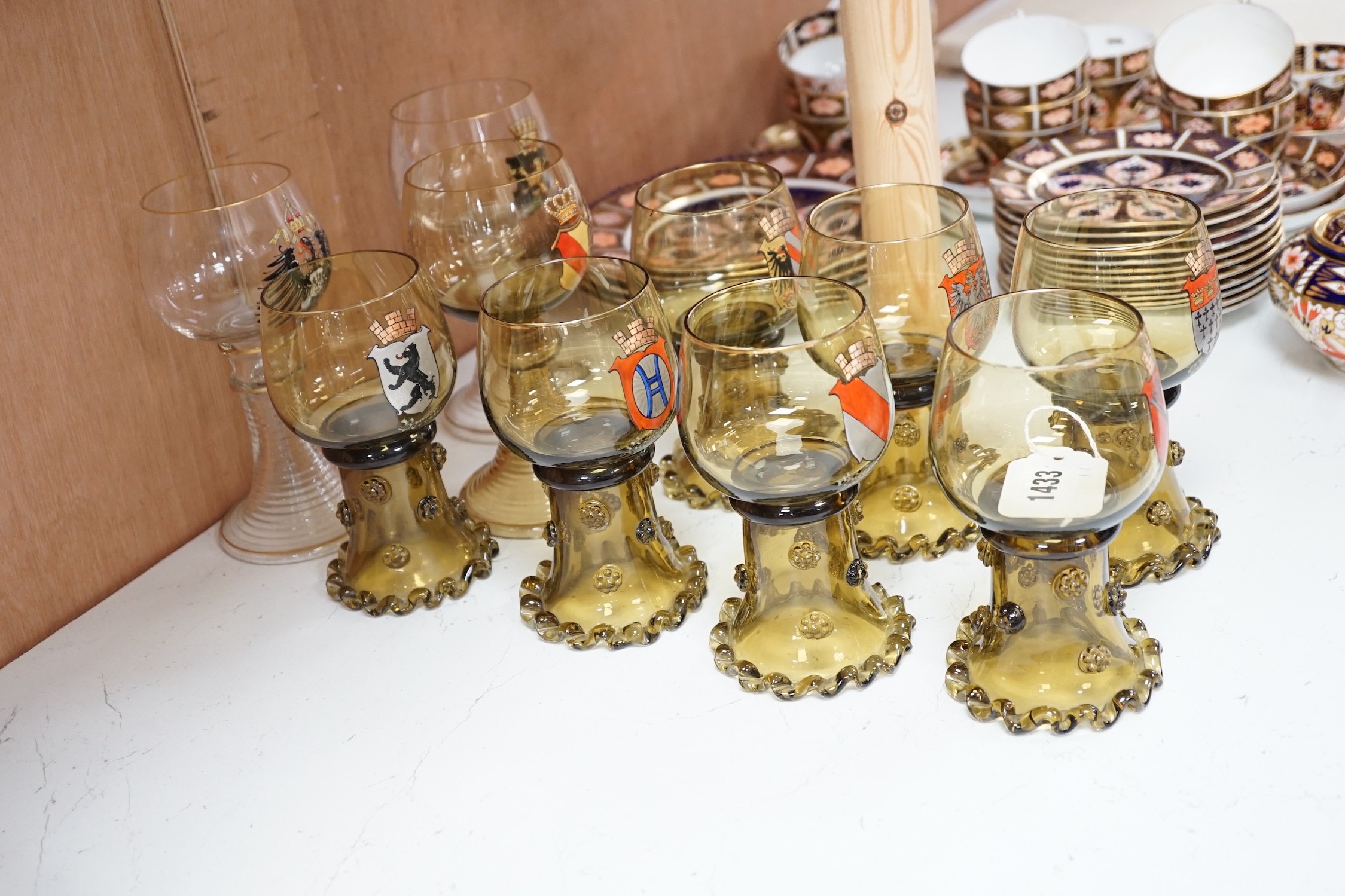 A set of six German enamelled green hock glasses, another larger hock glass and a pair of similar clear hock glasses (10)